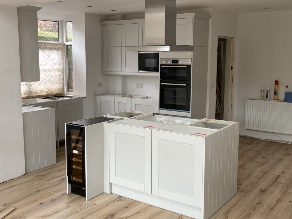 Wren kitchen units and integrated Bosch appliances during installation